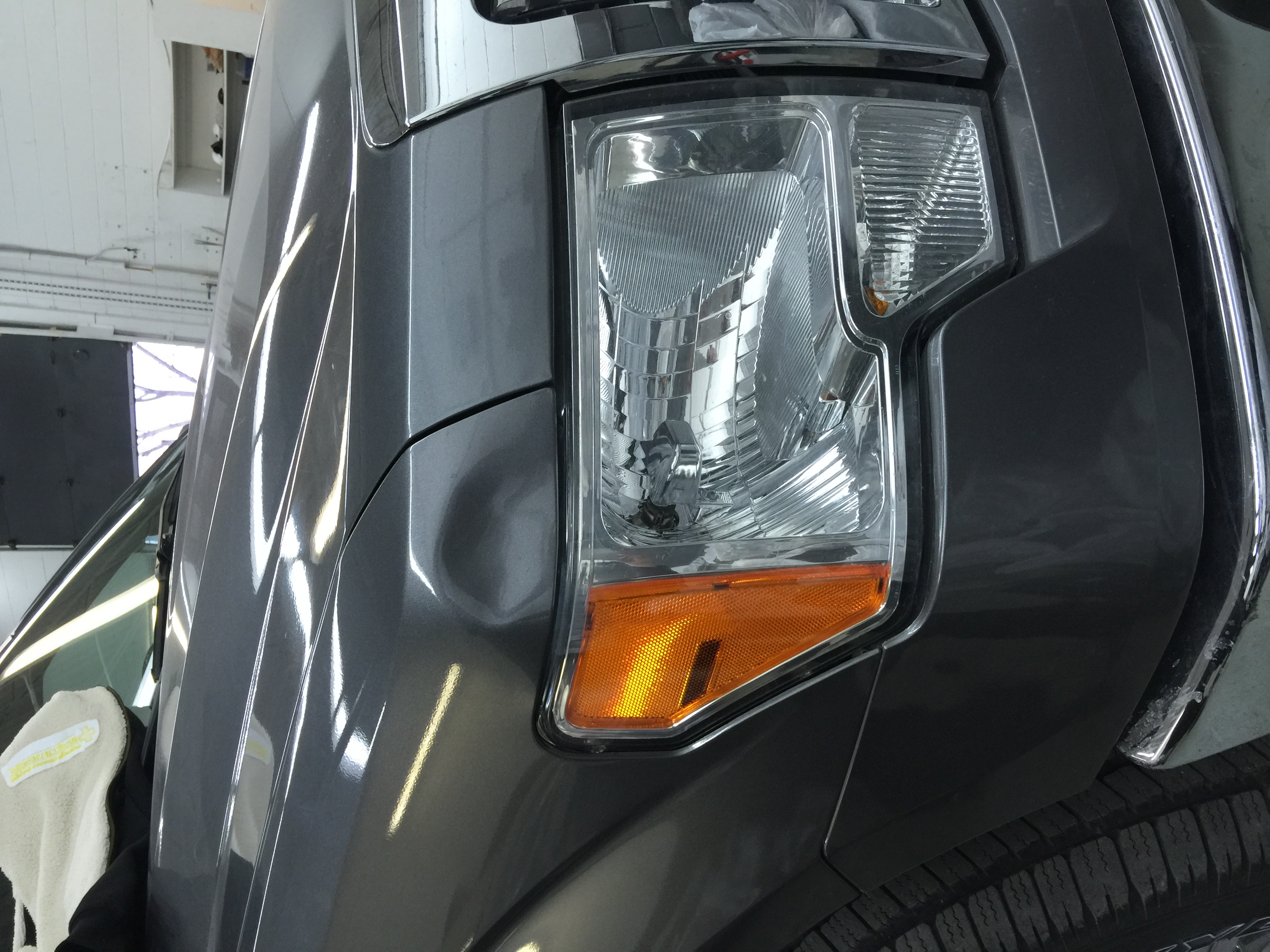 Before front fender dent near headlight