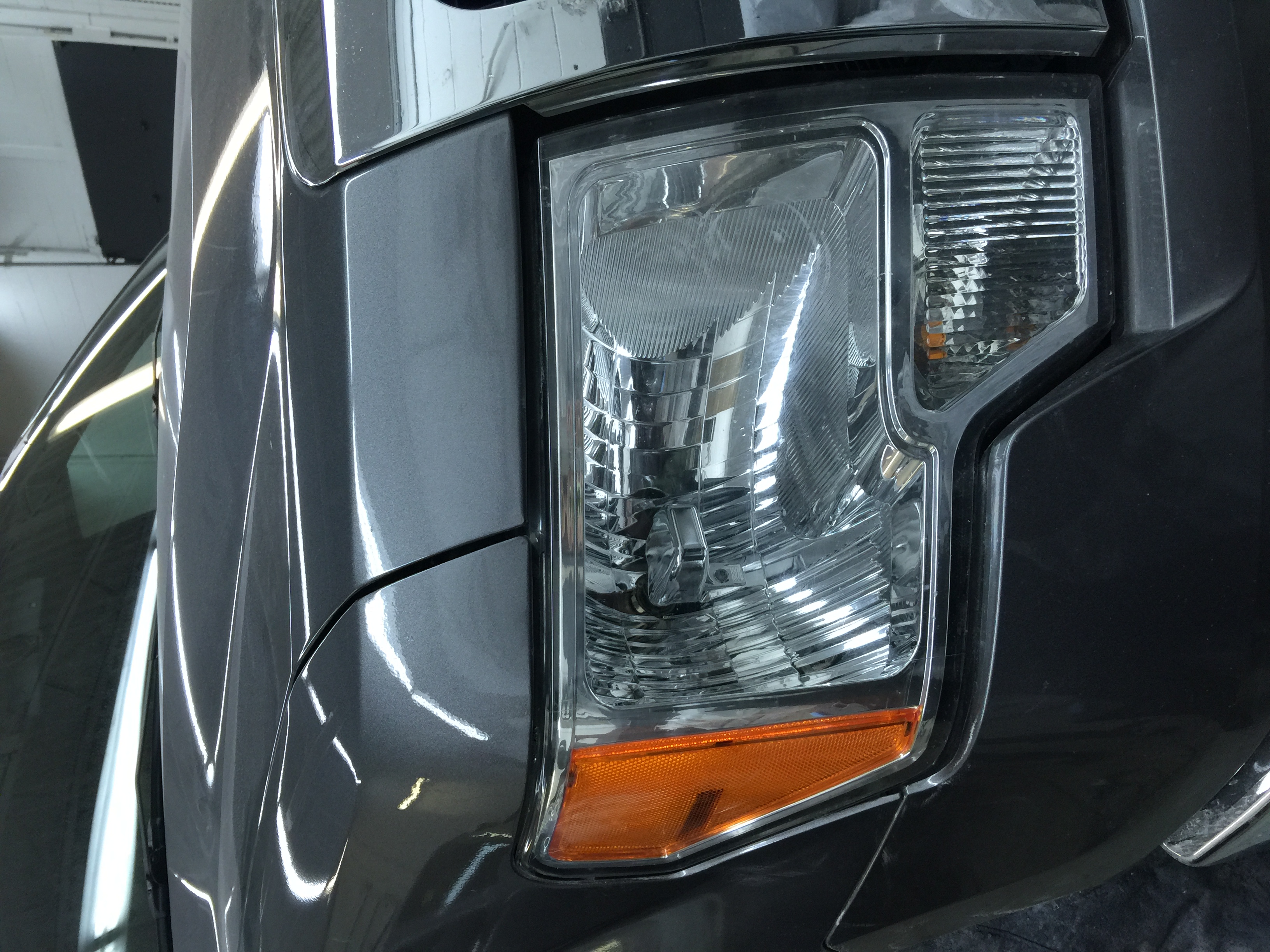 After front fender dent near headlight repair