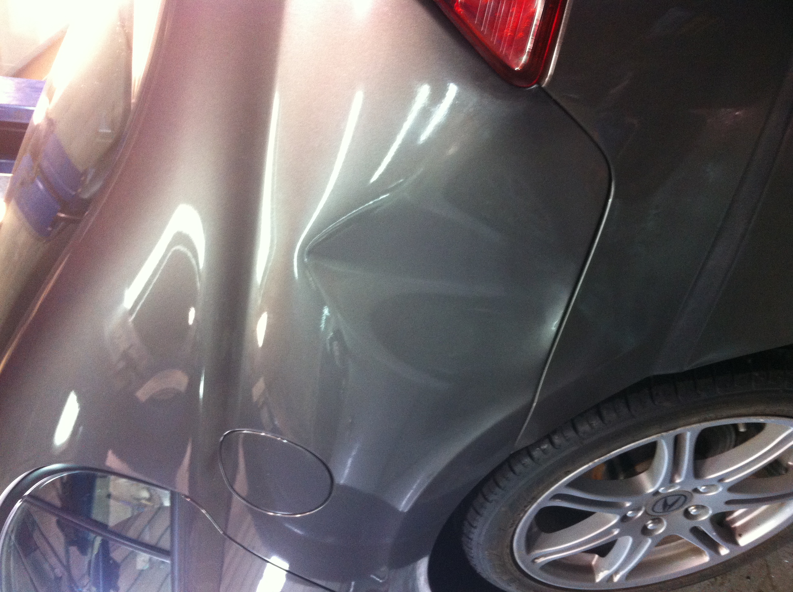 Before sharp rear quarter dent