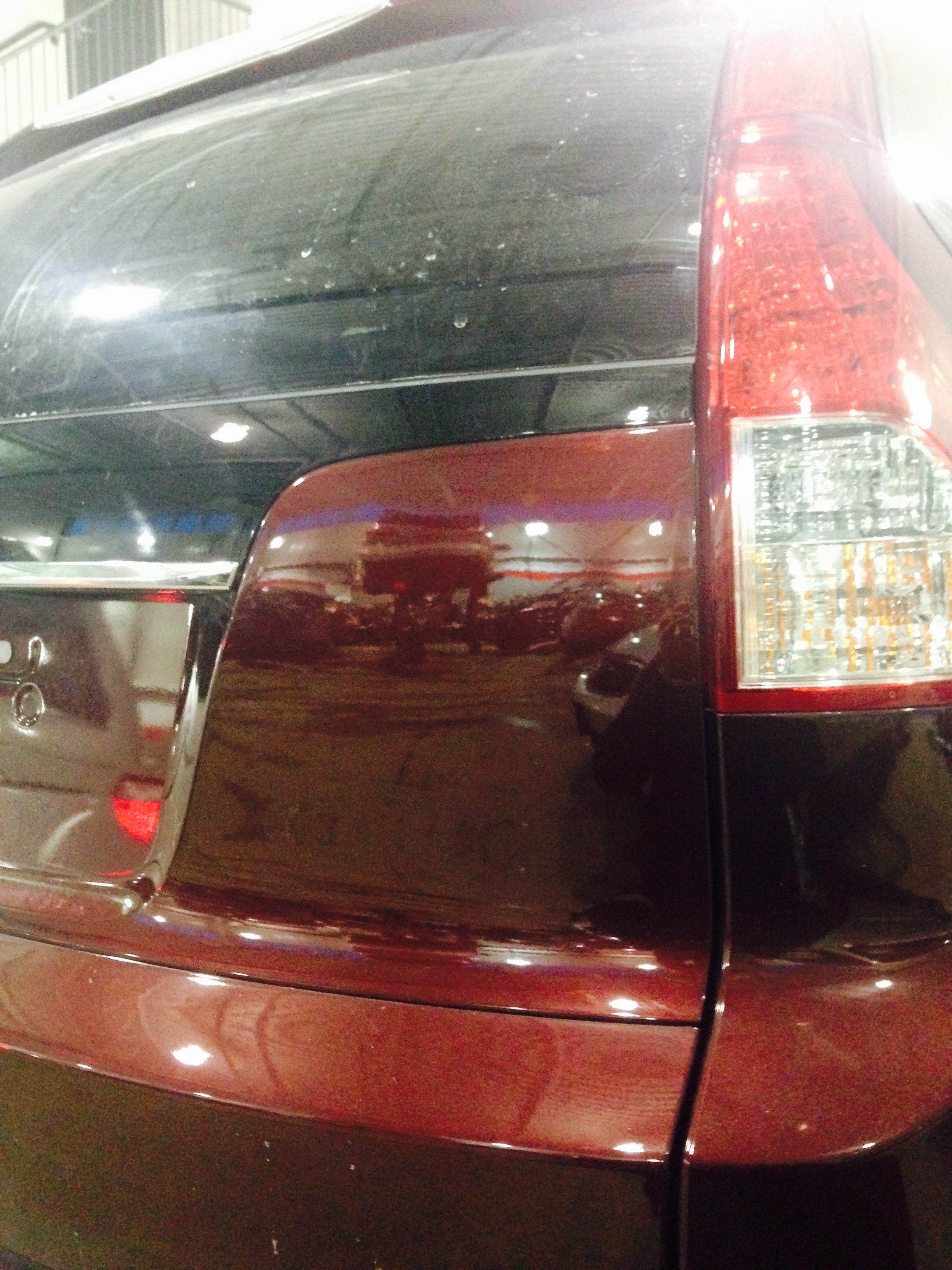 Before tailgate dent on maroon SUV