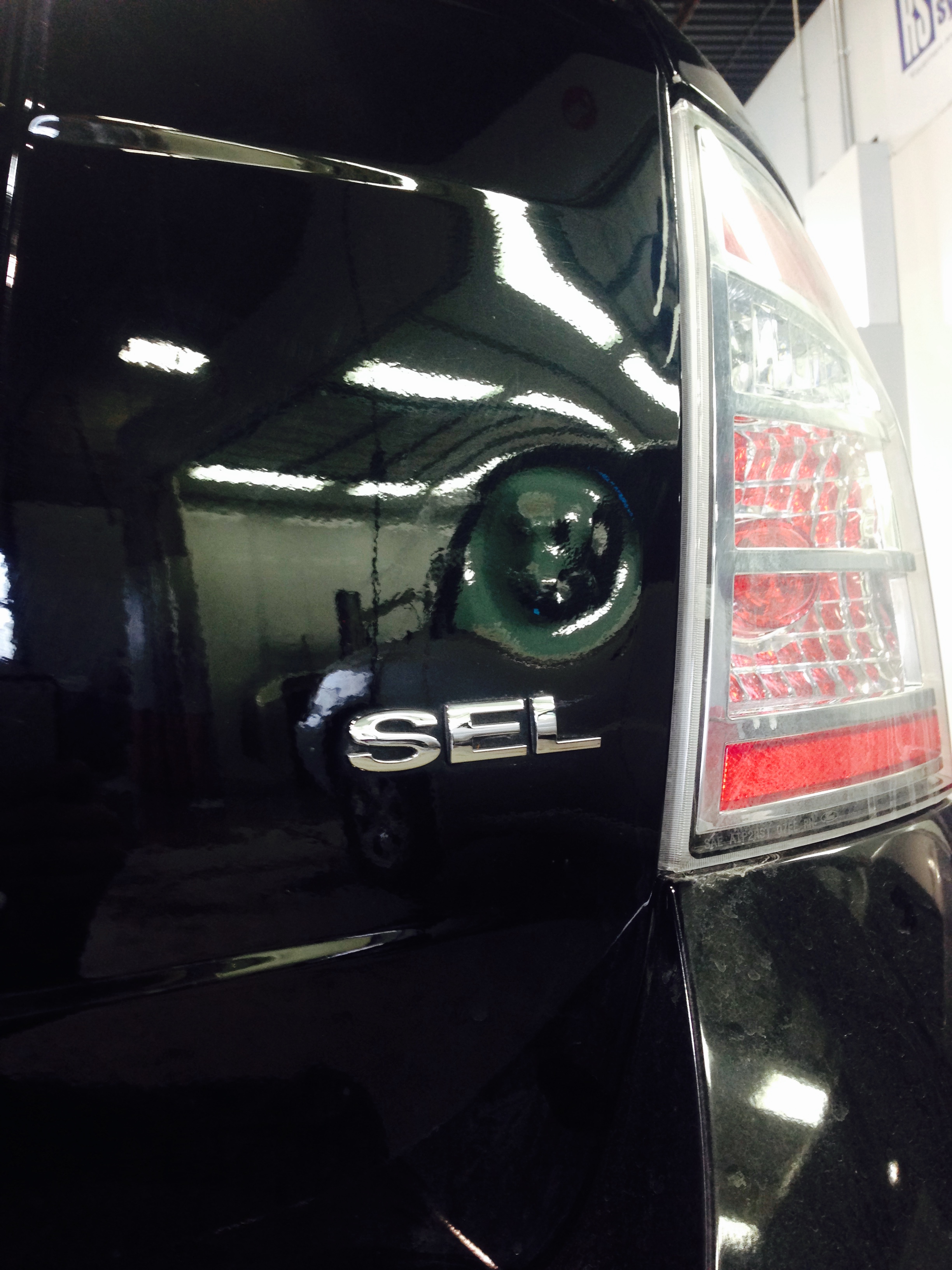 Before tailgate dent near SEL badge