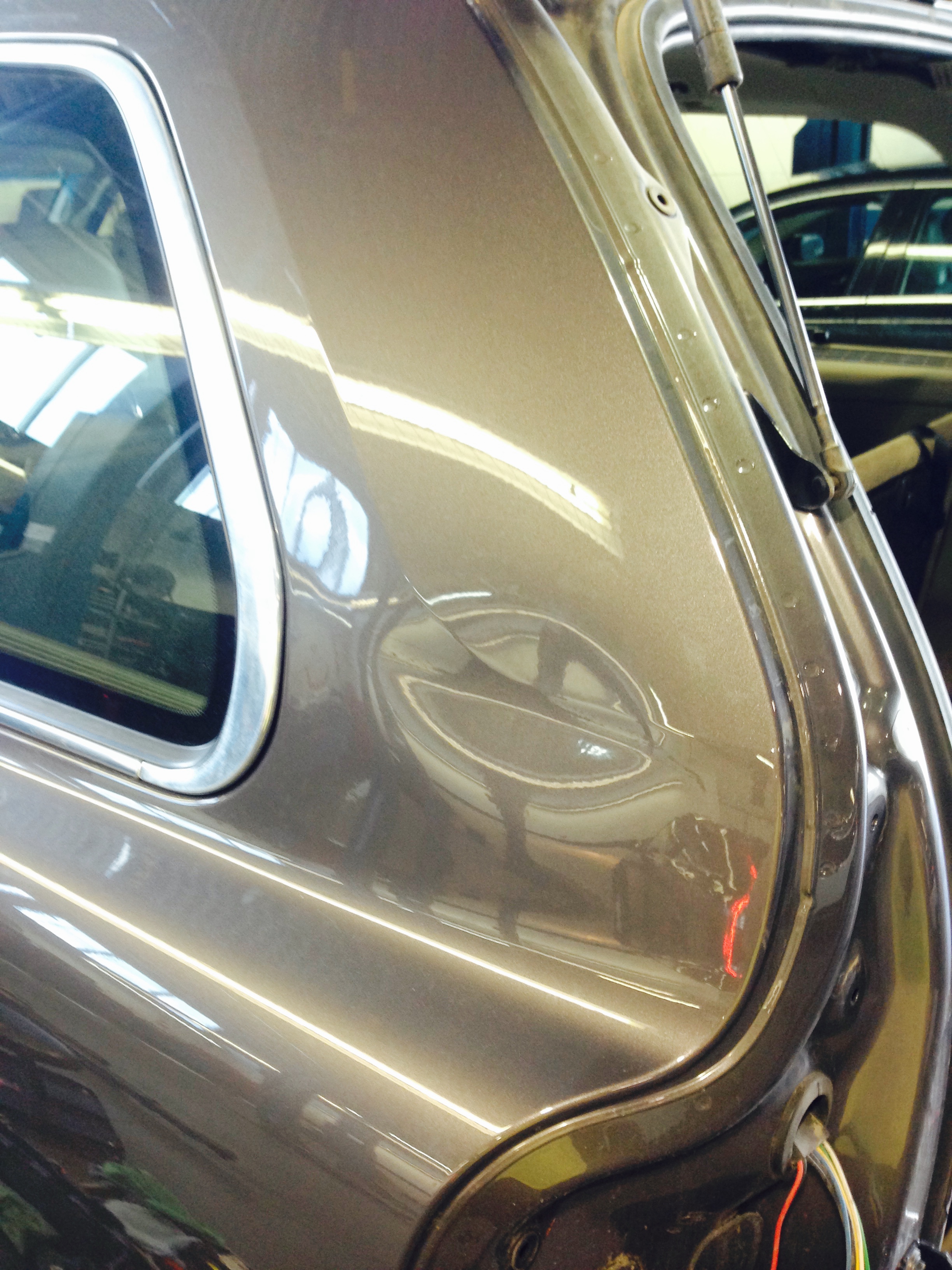 Before rear quarter hatch-side crease repair